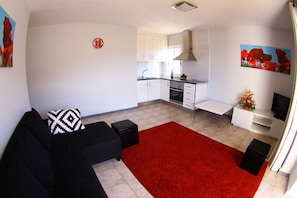 leaving room with open kitchen