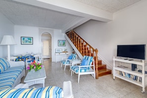 Living area leading to upstairs bedroom