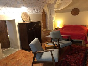 Downstairs main bedroom, large double bed, vaulted ceiling and fireplace