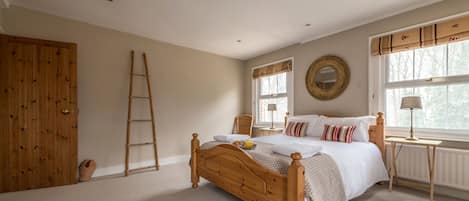 Large master en suite bedroom with rural views, luxury linen and towels