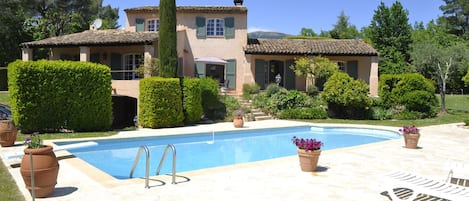 Villa and pool with mountains behind