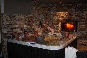 Terrace with fireplace and hot tub