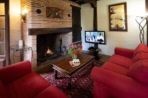 Cosy living room area in front of open fire