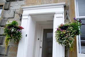 Always a warm welcome with stunning hanging baskets.