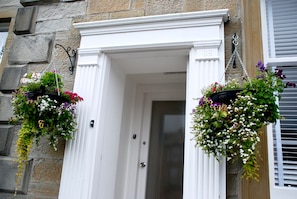 Always a warm welcome with stunning hanging baskets.