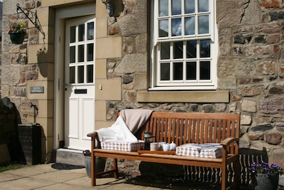 Spacious stone cottage, sleeps 6 with private garden.  Short walk to the beach