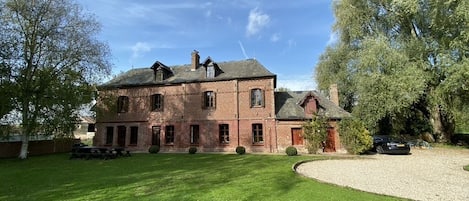 Beautifully furnished French Manor with Autumn sky
