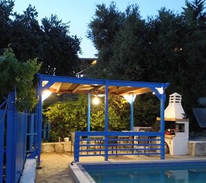 barbecue pergola at night
