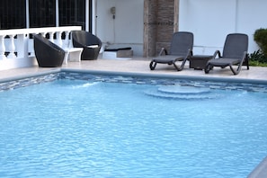 Swimming pool with outside shower