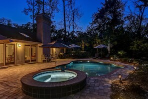 Private swimming pool at night.