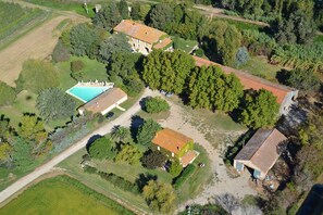 Aerial view of the private garden with the house in the middle