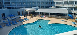 Main outdoor heated pool outside our villa.  Beach bar and grill under roof .