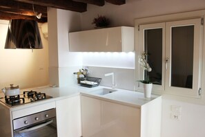 A comfortable and functional kitchen/living room, with a wonderful view