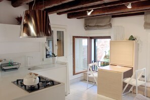A comfortable and functional kitchen/living room, with a wonderful view
