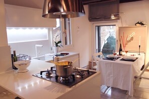 A comfortable and functional kitchen/living room, with a wonderful view