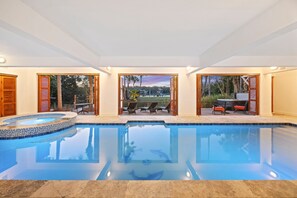 Private backyard oasis! Plunge into the private indoor pool