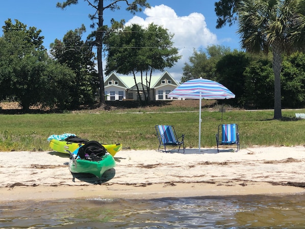 Beach area great for kayaking or surf fishing; house in background across Hwy 98