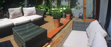 Lovely private outdoor patio garden, with heater, outdoor sofas and bbq