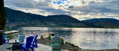 Beautiful outdoor area at lake level with BBQ, fire pit and private dock.