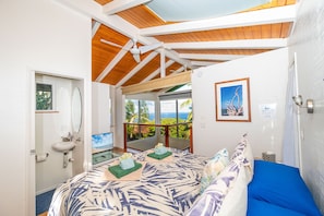 From your comfy king bed, sit up and watch the sun ormoon rise out of the ocean!