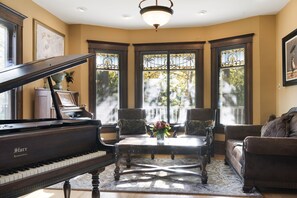 Music room: Baby grand piano, Antique pump organ, Guitars & other instruments