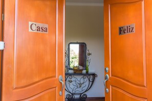Casa Feliz welcomes you through elegant double doorway at top of stairs. 