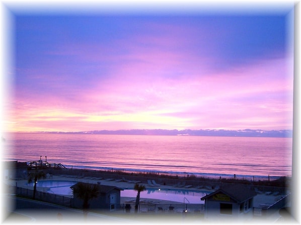 Sunrise on the balcony of our condo--311 B. Overlook ocean and pool. Great View!