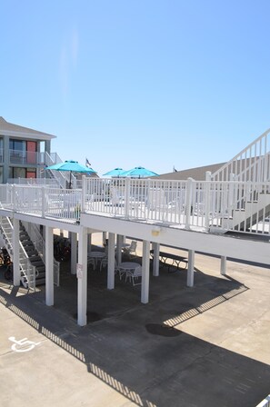 Underneath the deck are tables and chairs to stay out of the sun.