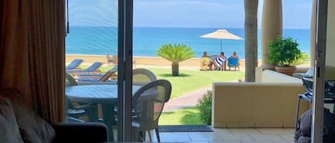 View from inside condo towards pool/ocean