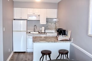 Kitchen has under the sink dishwasher, stove/oven, microwave and fully equipped.