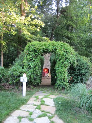 Path to cottage takes you past your fireplace patio