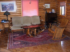 Living Room Area w/ old Secretary that is now Upstairs