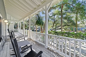 Front porch with views of the luscious greenery. A great place to unwind after a day full of activities.