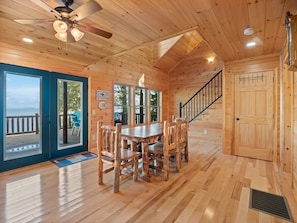 Dining room area with lots of windows showing the lake.
