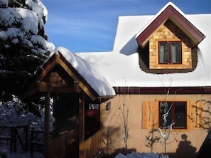 Chalet front entry with coverved walkway to main level