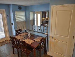 kitchen table seats up to six people. Stairway leading to the downstairs. 