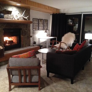 Living room with wood-burning fireplace