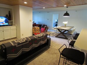 Dining area seats 8; breakfast bar seats 4. TV area has seating & sleeper couch