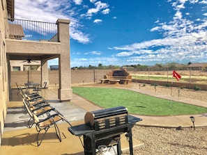 Backyard with BBQ, Gas Firepit, Water Feature, and Putting Green.