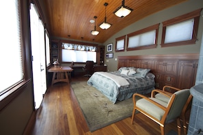 King size bed in upstairs sleeping area also has a futon sleeper coach.