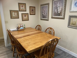 Large dining table.  A sixth chair is in Bedroom 1.