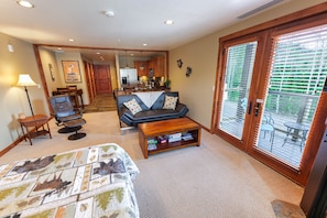 Interior of condo. Balcony doors on right.