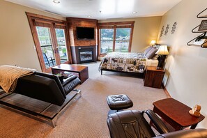 Interior of Condo. 568 sq ft. Balcony doors on left, gas fireplace