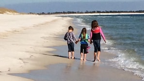 Walking the deserted beach at Fort McRee. 