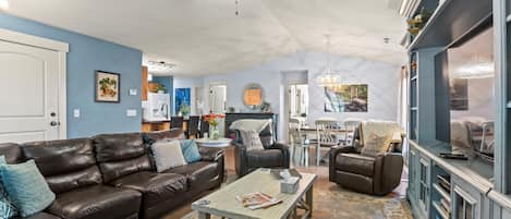 Living/Dining area with premium leather sectional and two leather recliners