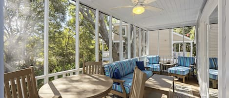 Lovely screened porch with furniture to lounge in!