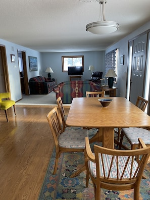 Large dining room table with additional leaves . Room for a family dinner.