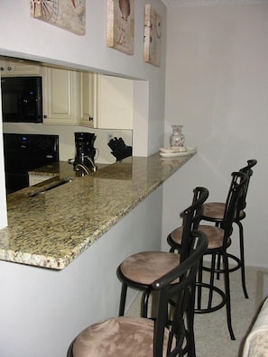 Breakfast bar with four stools.