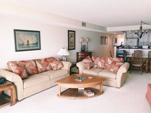 Open floor plan living room with pull out queen sofa bed