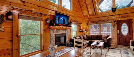 Bright vaulted ceiling Living Room with Stone Fireplace, queen sleeper sofa